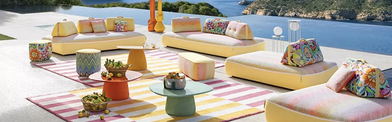 OWLHOME outdoor showroom with yellow lounge seating by the sea